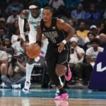 Oct 30, 2023; Charlotte, North Carolina, USA; Brooklyn Nets guard Lonnie Walker IV (8) brings the ball up court against the Charlotte Hornets during the second half at Spectrum Center. Mandatory Credit: Jim Dedmon-USA TODAY Sports