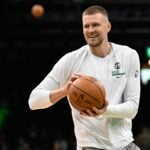 Nov 24, 2024; Boston, Massachusetts, USA; Boston Celtics center Kristaps Porzingis (8) warms up before a game against the Minnesota Timberwolves at TD Garden. Mandatory Credit: Eric Canha-Imagn Images