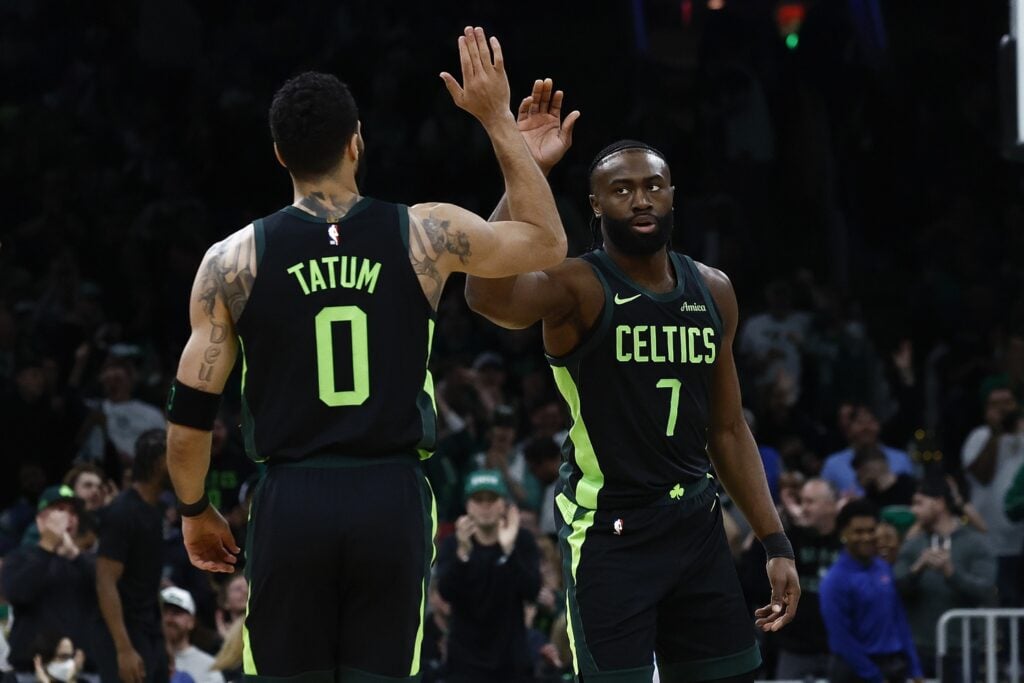 Boston Celtics guard Jaylen Brown (7) high fives forward Jayson Tatum