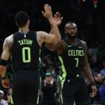 Boston Celtics guard Jaylen Brown (7) high fives forward Jayson Tatum