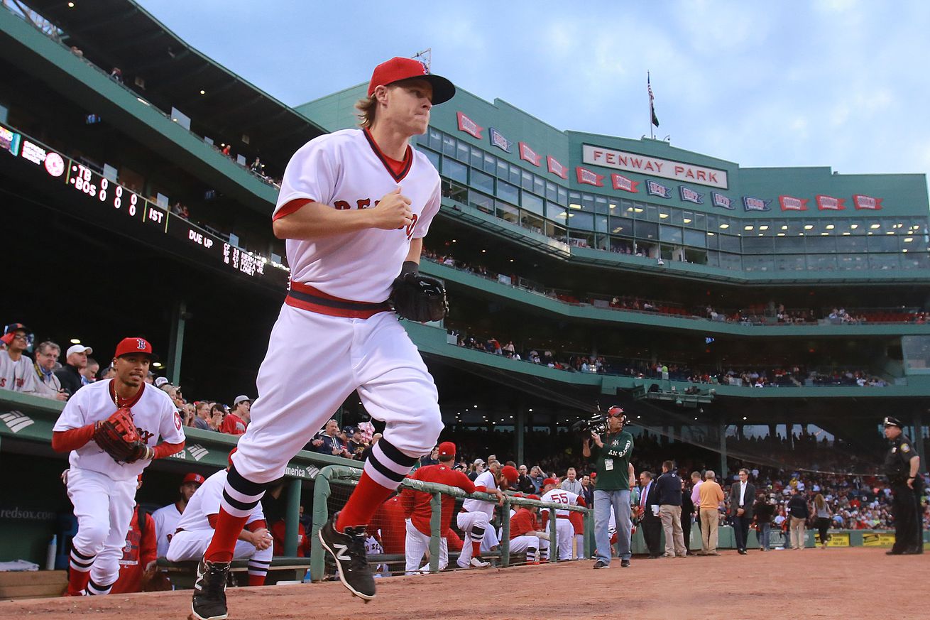 (05/05/2015 Boston, MA) Boston Red Sox center fielder Brock Holt and Mookie Betts, left, take the field wearing a 1975 throwback uniform at Fenway Park on Tuesday, May 5, 2015. Staff Photo by Matt West