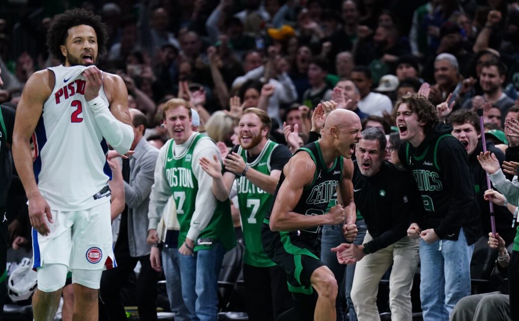 Boston Celtics guard Jordan Walsh (27) and Detroit Pistons guard Cade Cunningham (2) react after an out of bound ball called in the Celtics favor in the last seconds of the fourth quarter at TD Garden.
